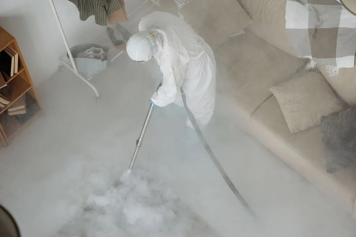 Biohazard cleanup technician in protective equipment, Hurley, WI
